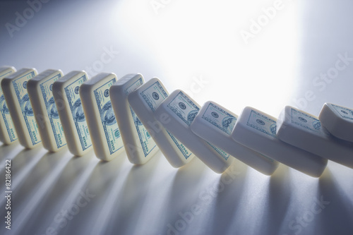 Close up of falling stacks of dollar bills photo