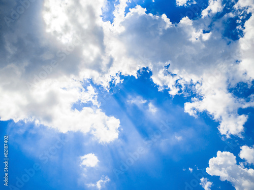 rays light blue sky clouds background