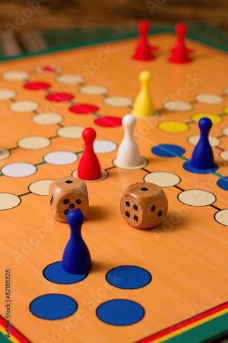 Twice one on woode dices on Ludo board