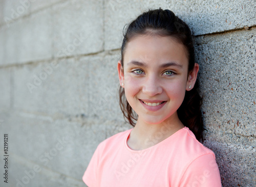 Portrait of a beautiful preteen girl with blue eyes