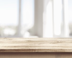 Background. Wooden table on defocuced window with curtain