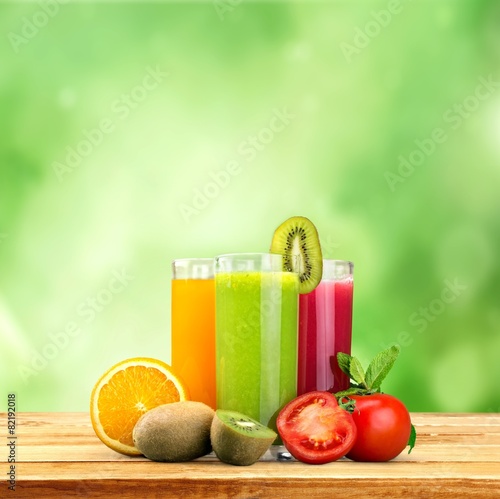 Detox. Fresh vegetable juices on wood plant