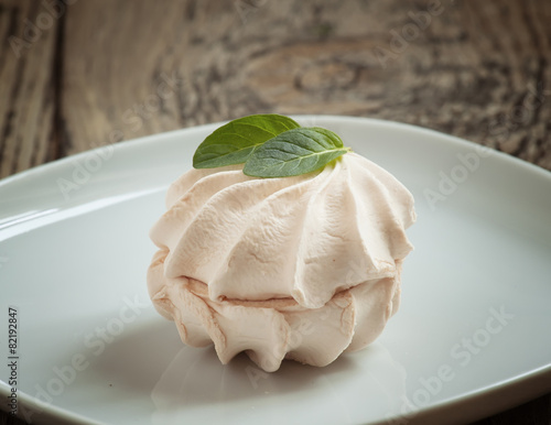 Zephyr (souffle), marshmallow on a wooden table photo