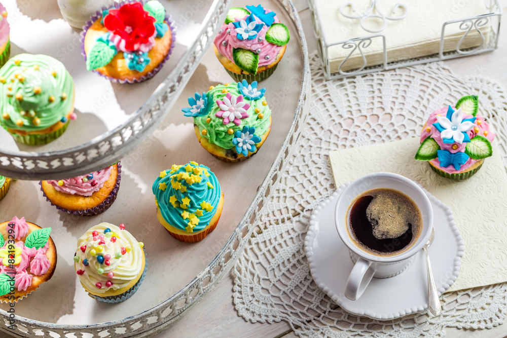 Sweet muffins with cream and sweet decoration