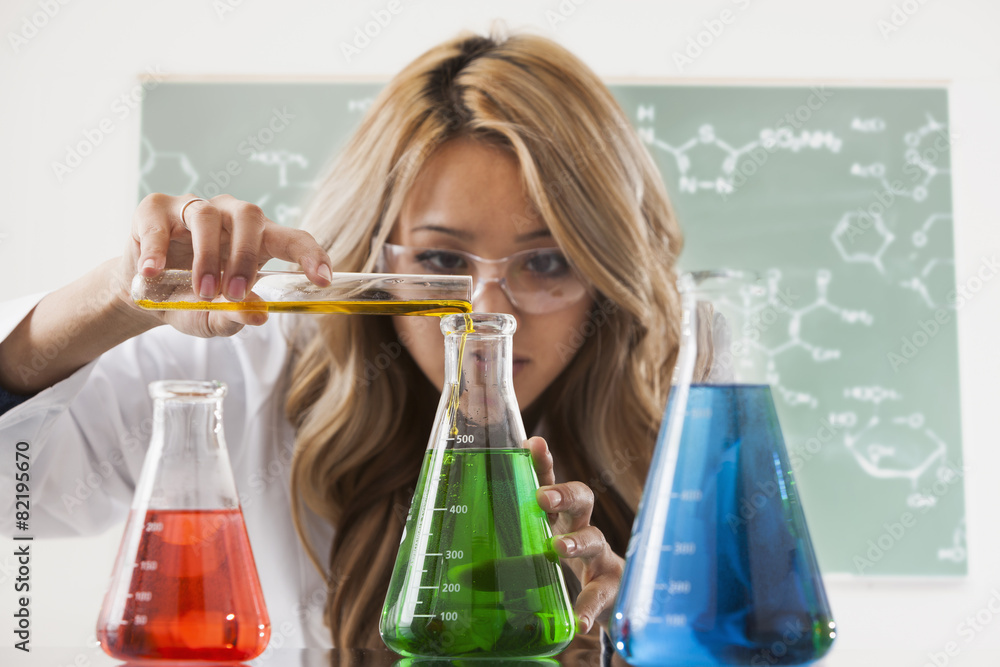 © Mike Kemp/Blend Images - Mixed race student working in chemistry lab