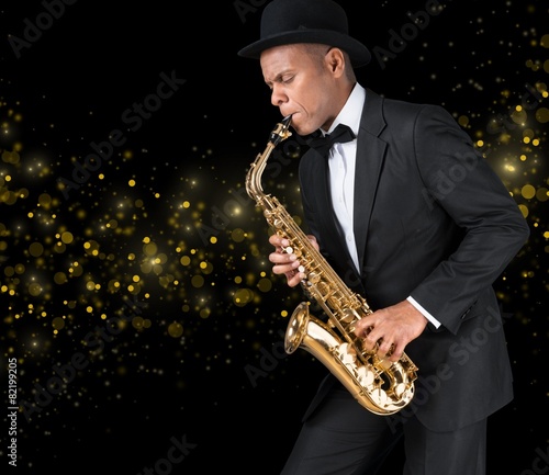Sax. Black american jazz saxophone player. Vintage. Studio shot.
