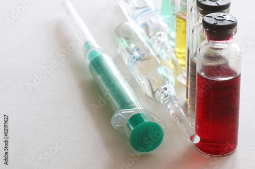 background medicine pill vials syringes