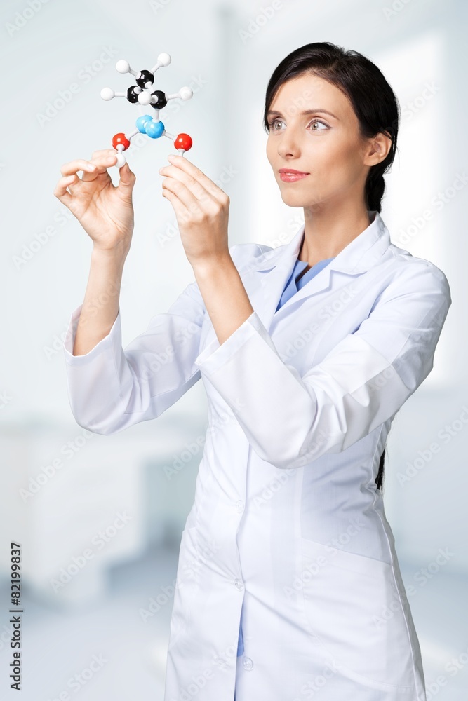 Scientist. Researcher looking at a molecular structure Scientist. Researcher looking at a molecular structure