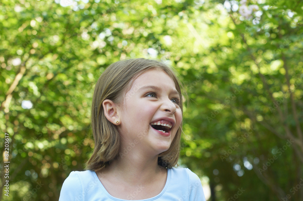 Hispanic girl laughing outdoors Hispanic girl laughing outdoors
