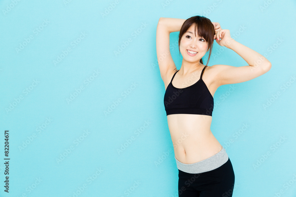 sporty asian woman on blue background sporty asian woman on blue background