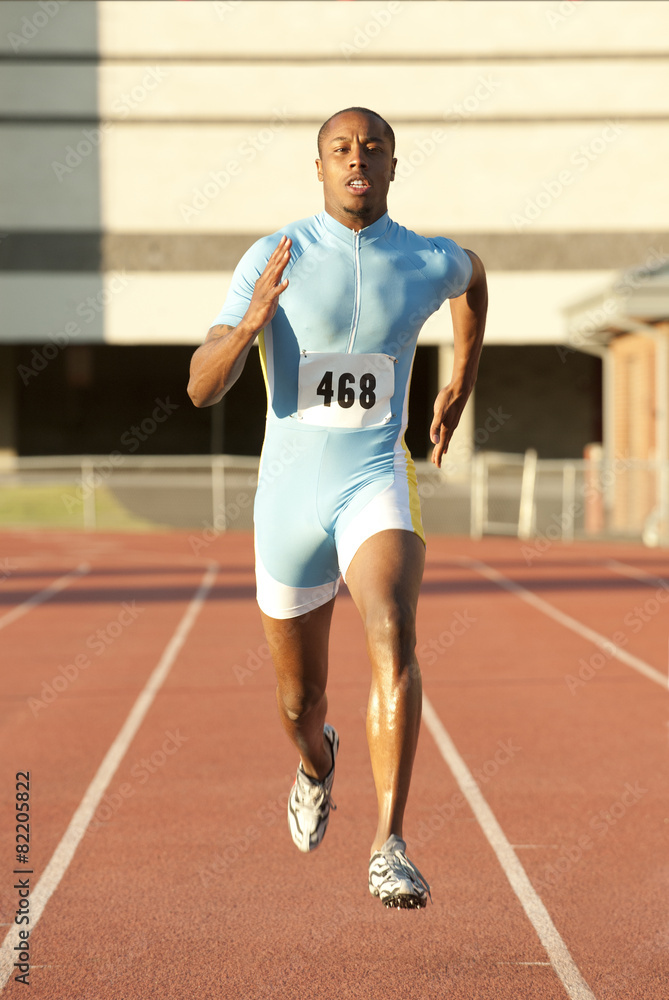 Black runner running on track Black runner running on track