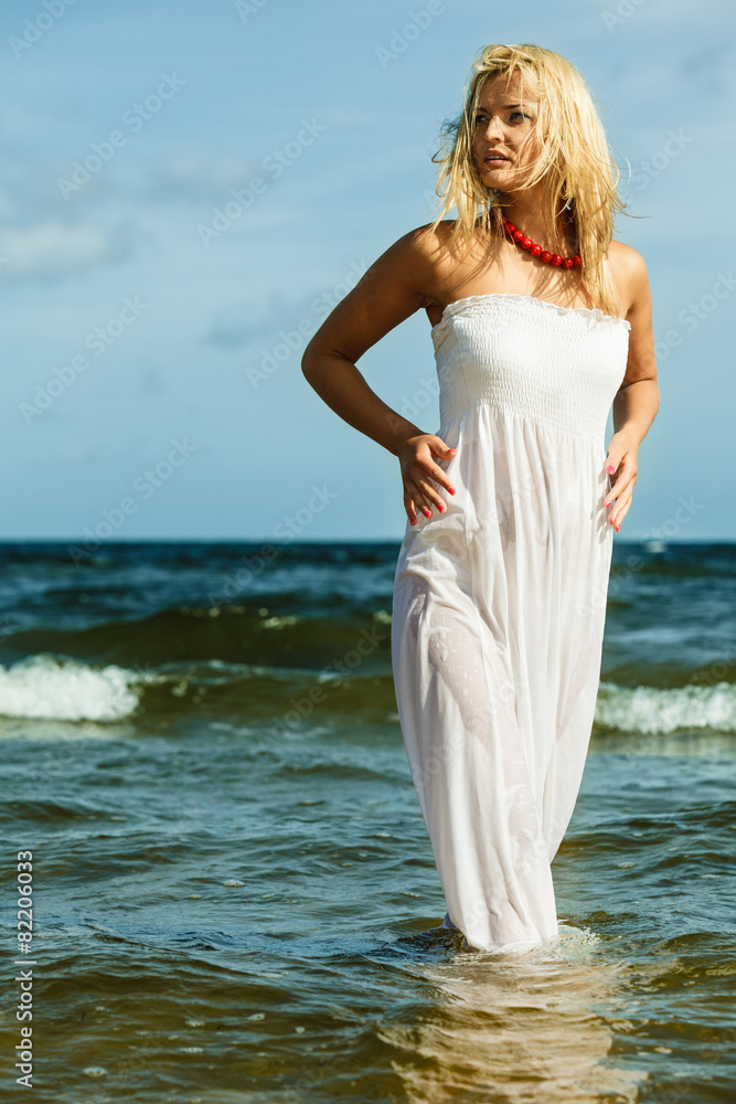 Beautiful blonde girl on beach, summertime Beautiful blonde girl on beach, summertime
