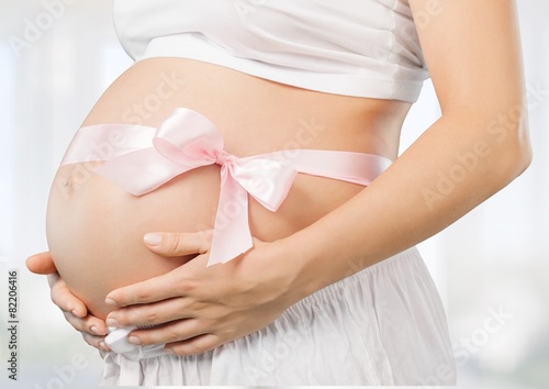 Wallpaper Mural Abdomen. Pregnant belly with pink ribbon Torontodigital.ca