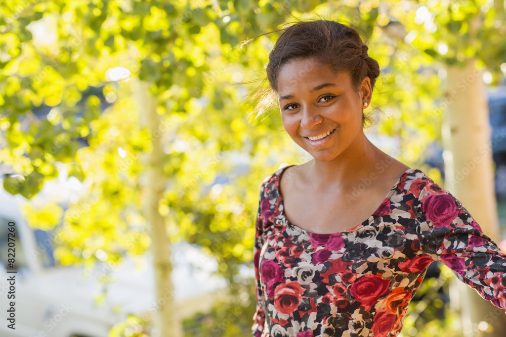 Mixed race teenage girl smiling outdoors Mixed race teenage girl smiling outdoors