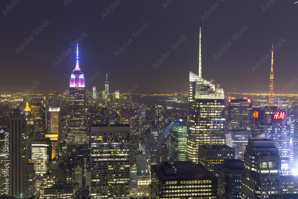 Manhattan night landscape with skyscrapers - obrazy, fototapety, plakaty 