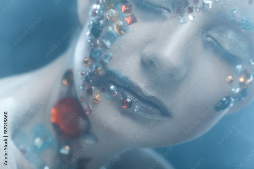Fototapeta premium Closeup portrait of woman with artistic make-up.