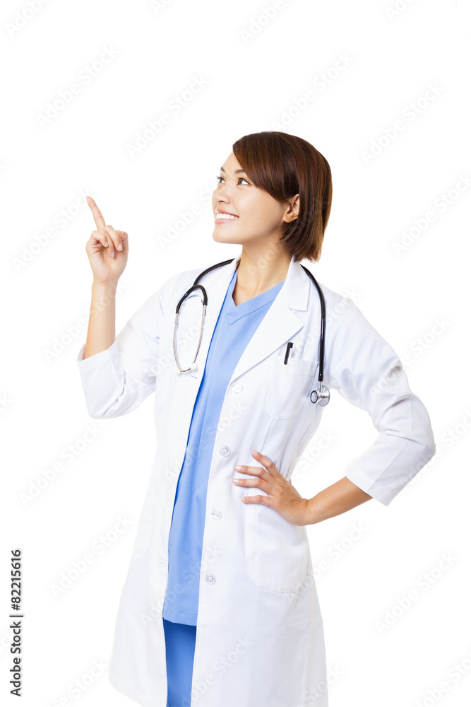 Smiling medical doctor woman pointing Smiling medical doctor woman pointing