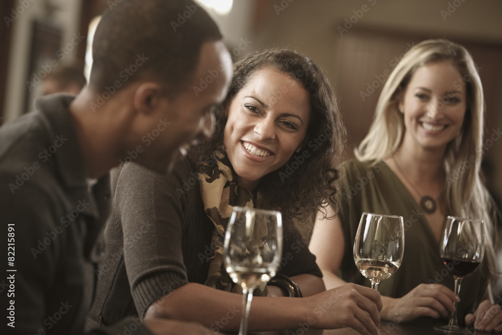 © John Fedele/Blend Images - Friends drinking wine together