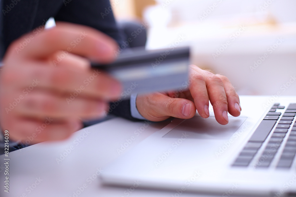 Businessman using laptop and mobile phone Businessman using laptop and mobile phone