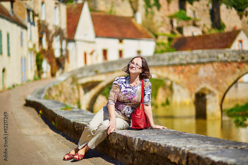 Beautiful middle aged woman in Burgundy photo