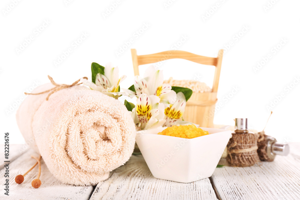 Spa still life with flower on wooden table isolated on white Spa still life with flower on wooden table isolated on white