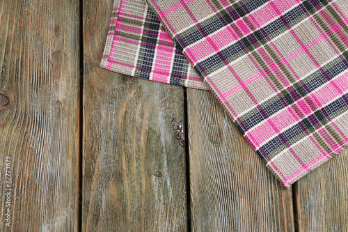 Checkered napkin on wooden table background