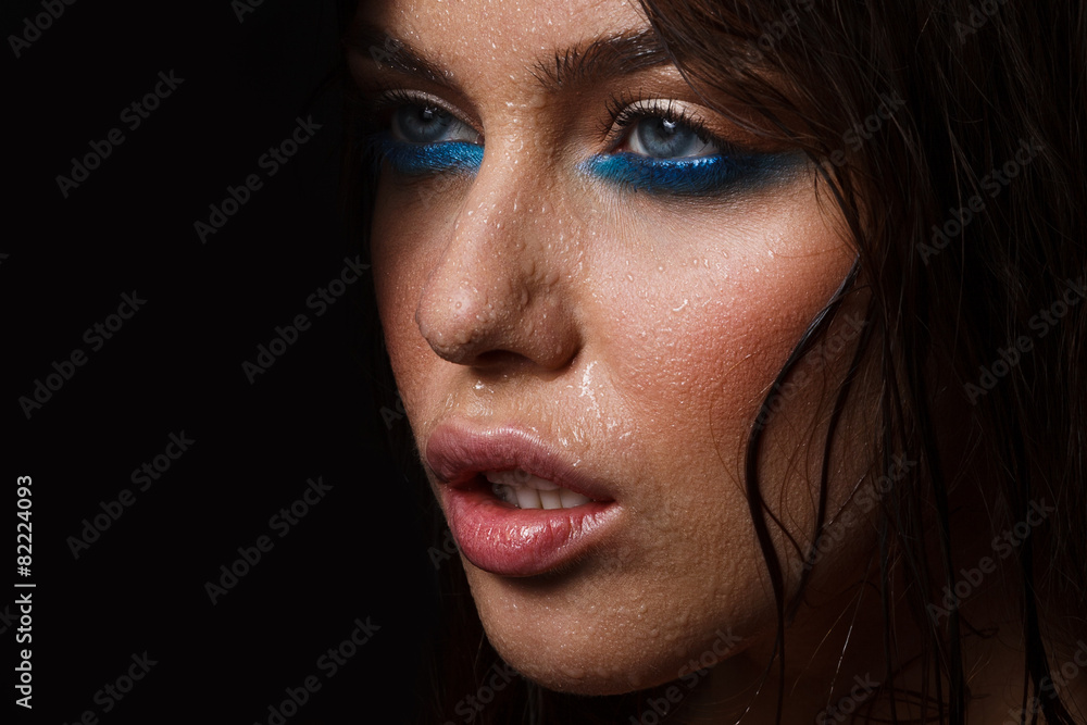 Fototapeta premium Wet woman portrait with water drops on the face