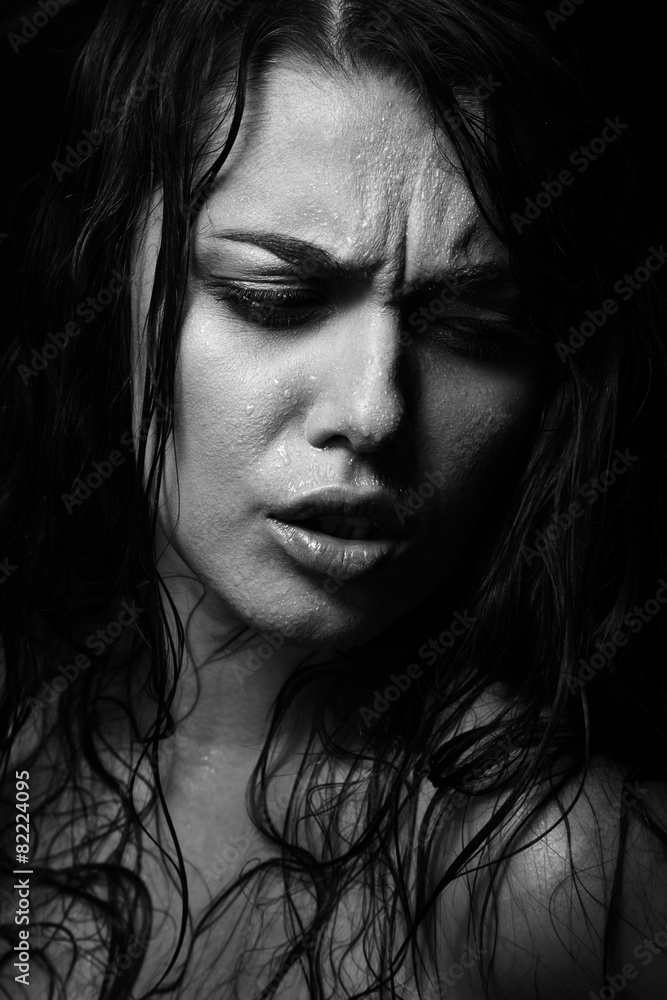 Wet woman portrait with water drops on the face. Black and white Wet woman portrait with water drops on the face. Black and white