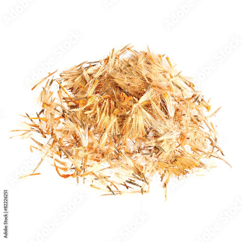 Pile of Mountain arnica, Arnicae flos isolated on white. photo