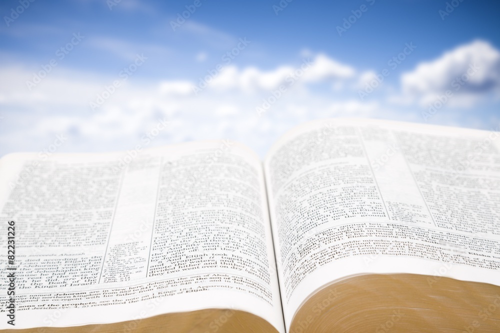 Open. Detail of an old holy bible open with a beautiful and Open. Detail of an old holy bible open with a beautiful and