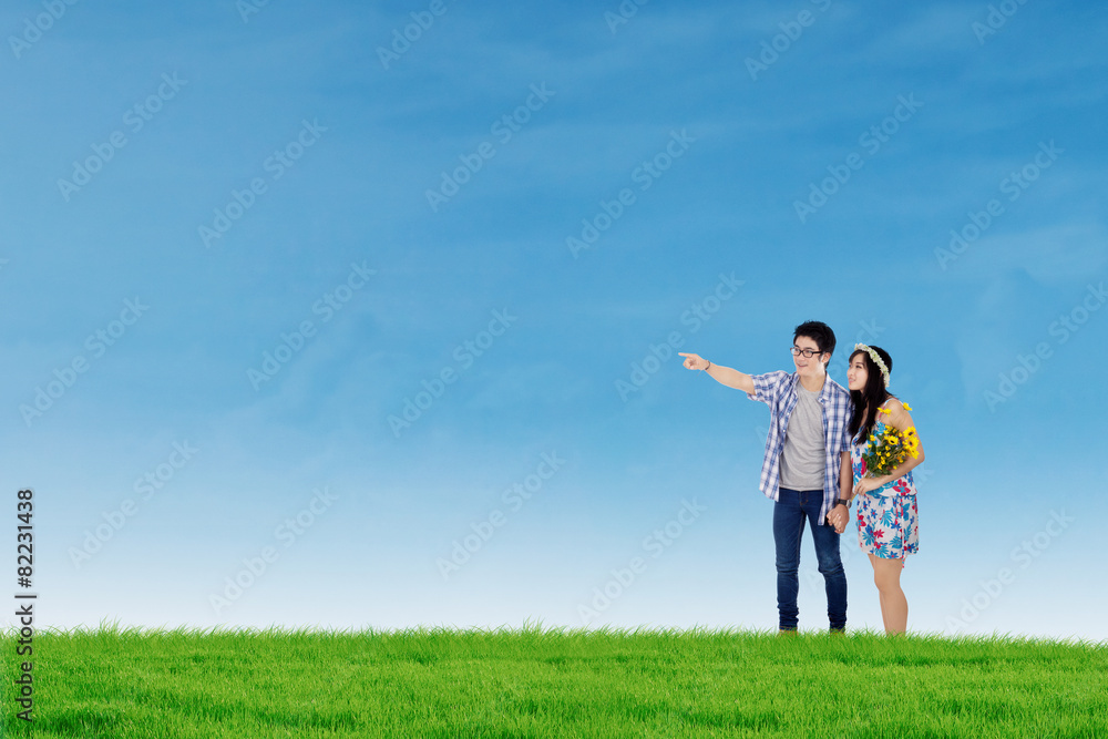 Happy couple in nature under blue sky Happy couple in nature under blue sky