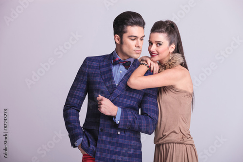 fashion woman smiling while leaning on her lover.
