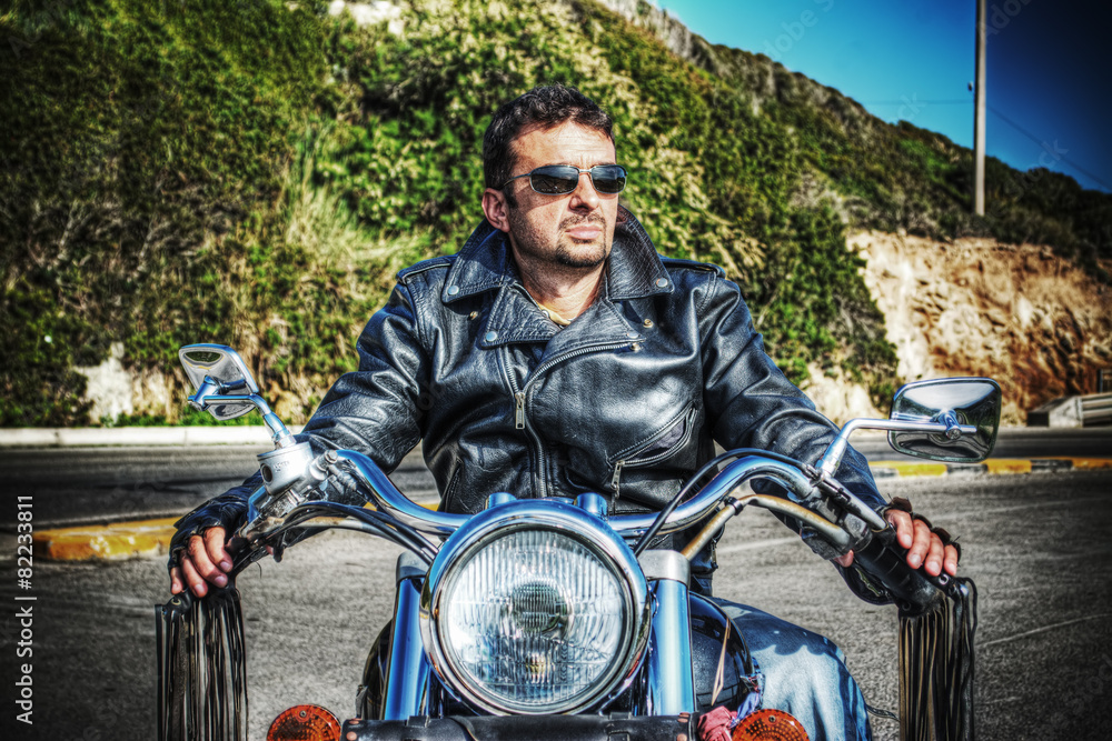 front view of  biker and motorcycle in hdr