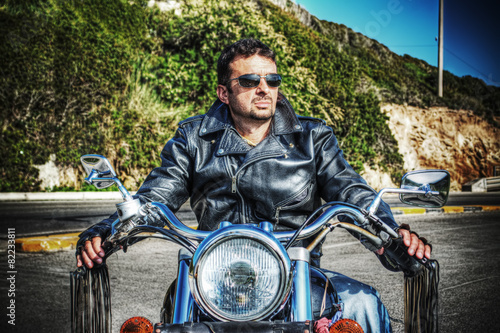 front view of biker and motorcycle in hdr