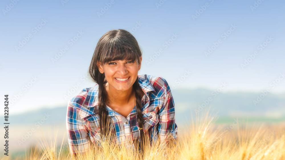 Smiling beautiful young brazilian girl on a yellow crop field Smiling beautiful young brazilian girl on a yellow crop field