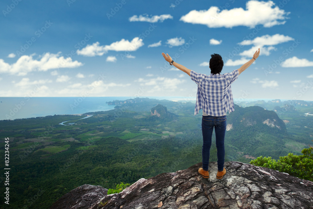 Man enjoy fresh air at mountain peak