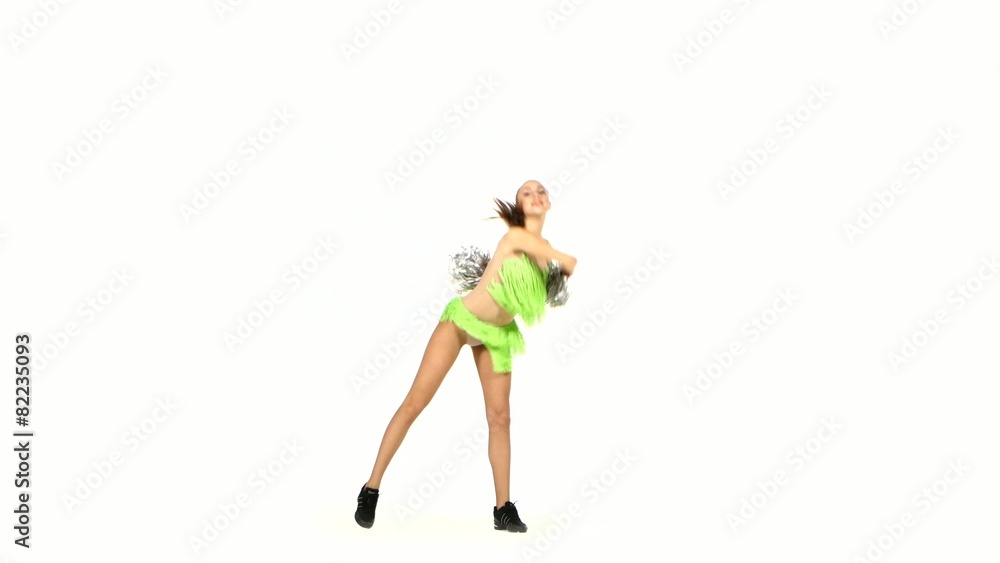 Girl in green costumes with pompons make element acrobatic Girl in green costumes with pompons make element acrobatic