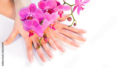 manicure and orchid on white - wellness and care