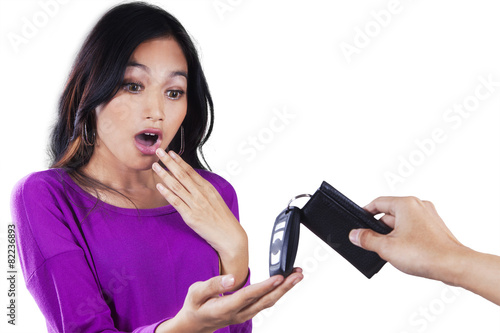 Surprised teenage girl get a car key © Creativa Images