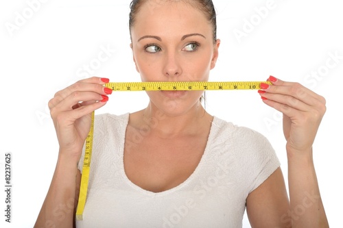 Healthy Young Woman Holding a Tape Measure