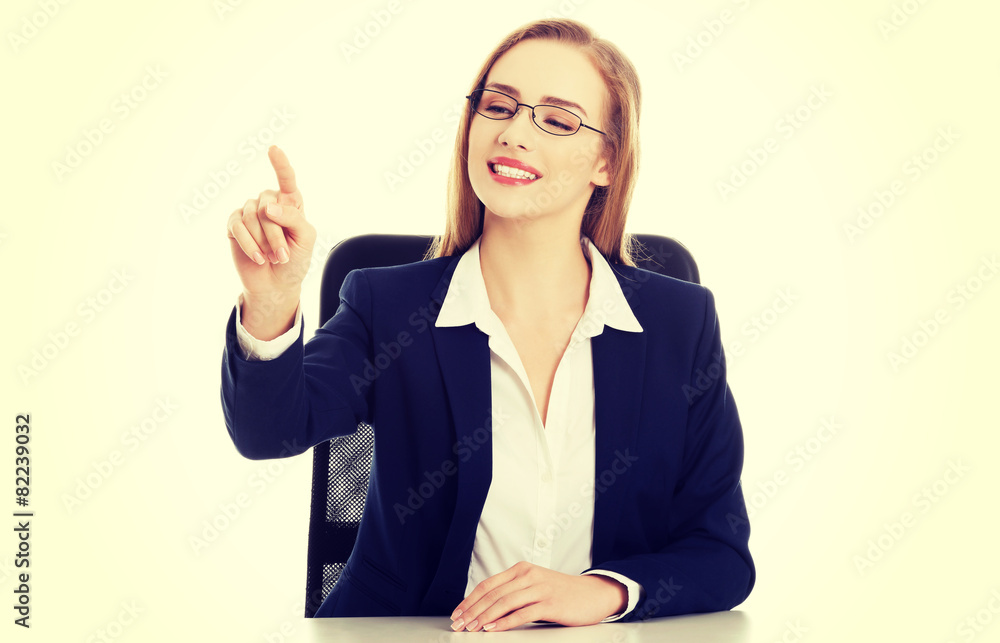 Businesswoman pointing her finger Businesswoman pointing her finger