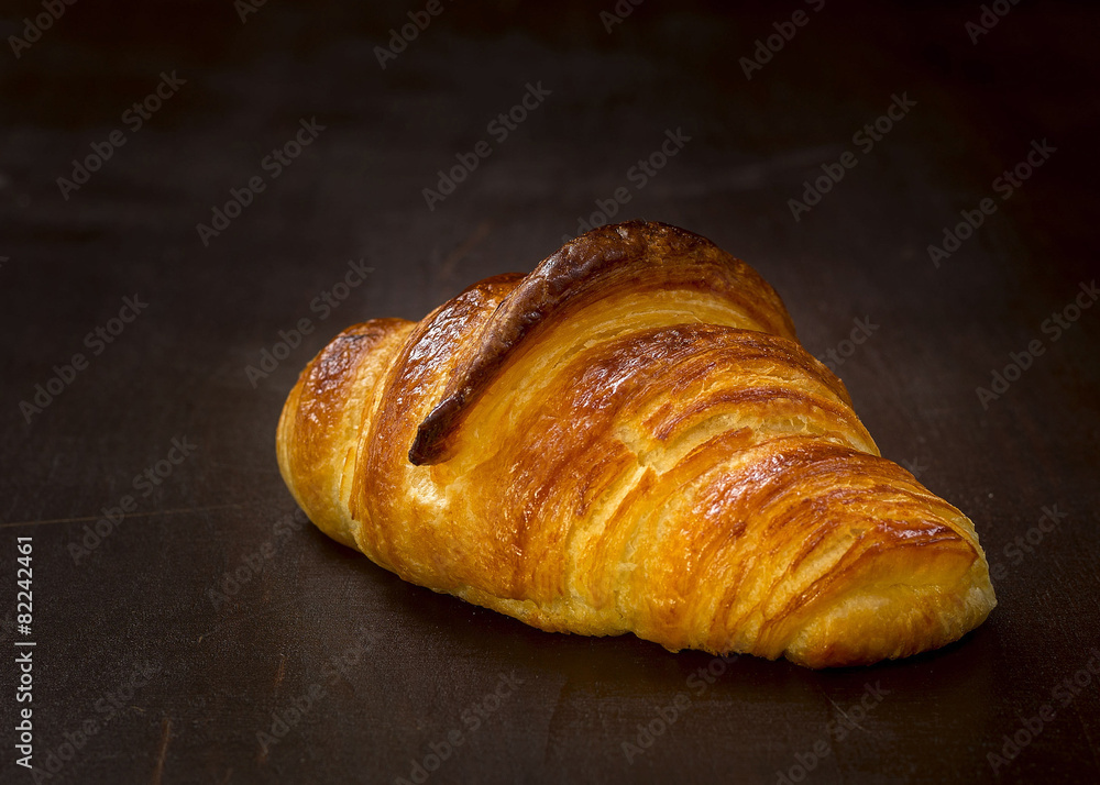 french croissant on a wooden table french croissant on a wooden table