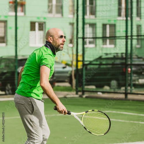 man play tennis outdoor © sarymsakov.com