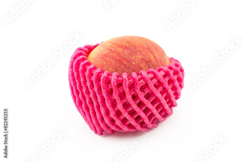 one apple with foam protection net on isolated white background