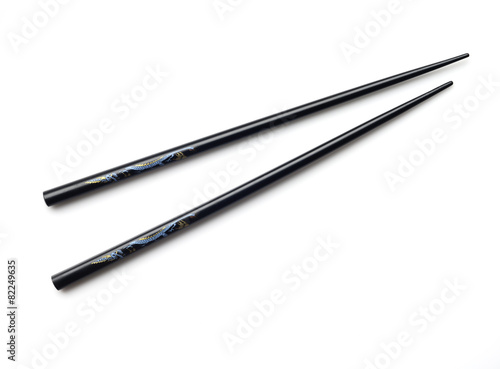 Black wooden chopsticks on white background