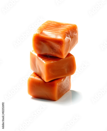 stack of toffee caramel candy close-up isolated on white