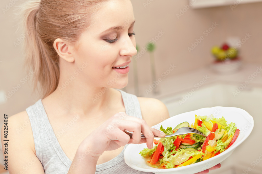 Young woman cooks salad Young woman cooks salad