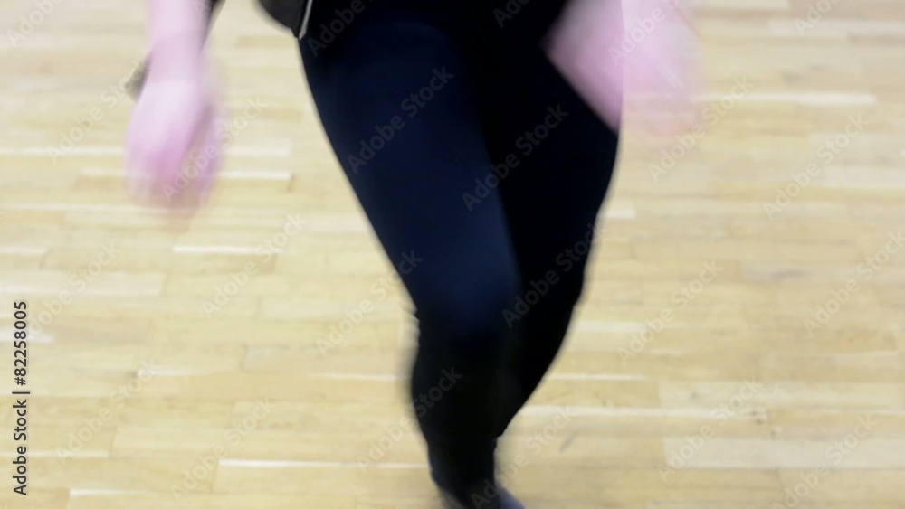 young attractive woman dancing - hall - shot on legs and face young attractive woman dancing - hall - shot on legs and face
