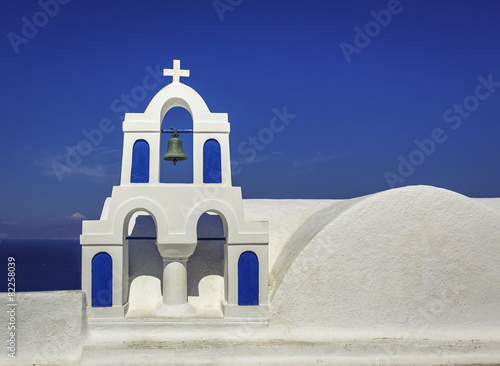Chapel with the bell against blue sky in Greece.