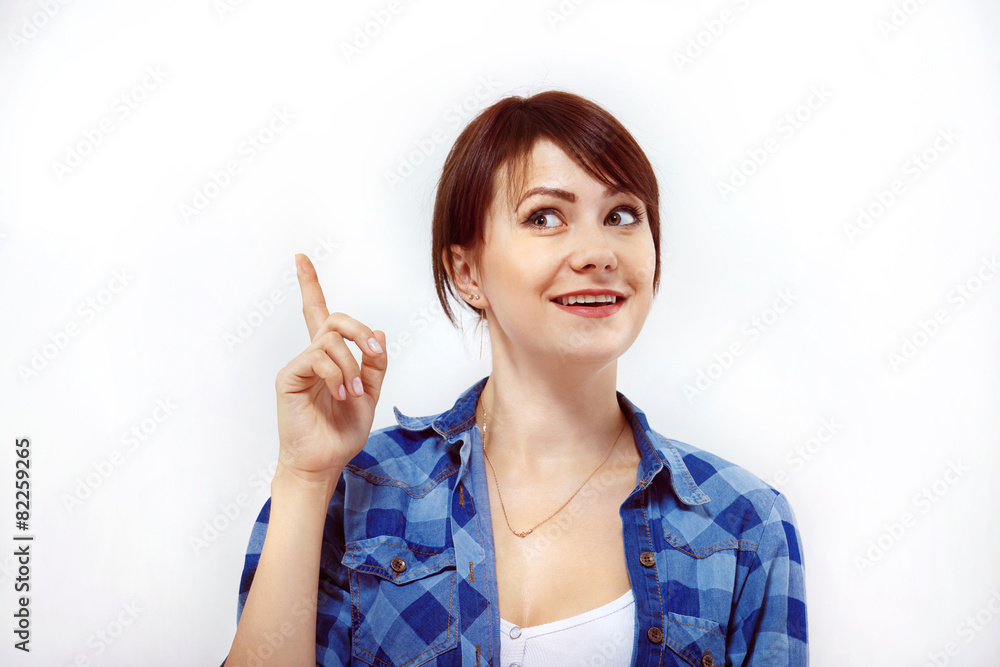 Beautiful woman showing hand on something and looking up isolate Beautiful woman showing hand on something and looking up isolate
